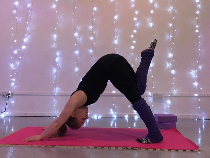 Kitty downward dog leg lift